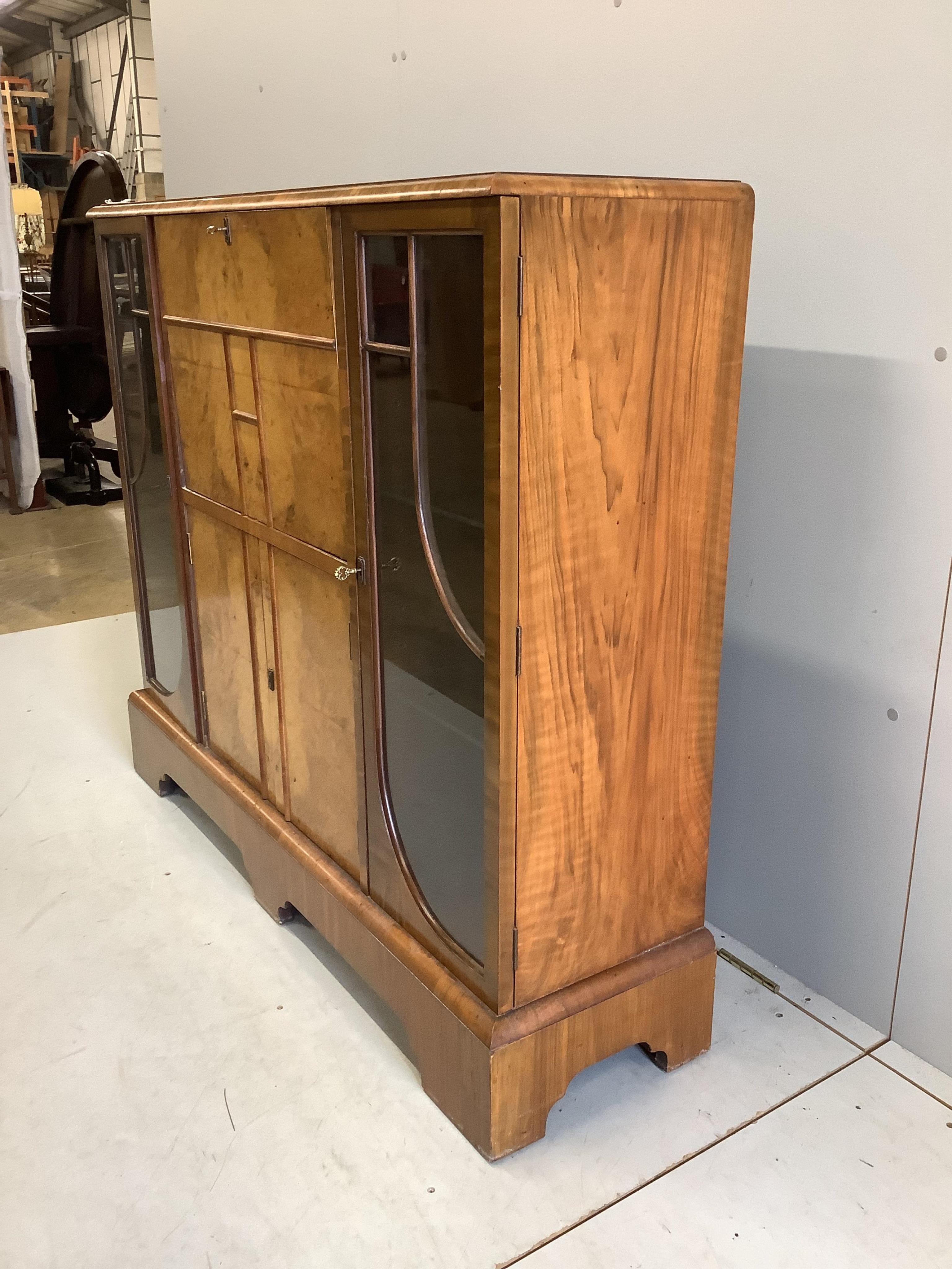 An early 20th century Art Deco style burr walnut secretaire cabinet, width 122cm, depth 34cm, height 107cm. Condition - fair to good.